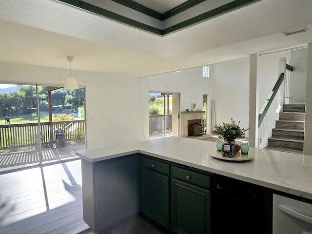 kitchen featuring light stone countertops and pendant lighting