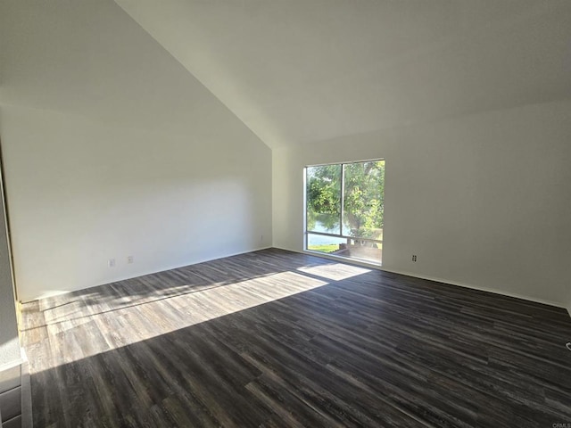 unfurnished room with high vaulted ceiling