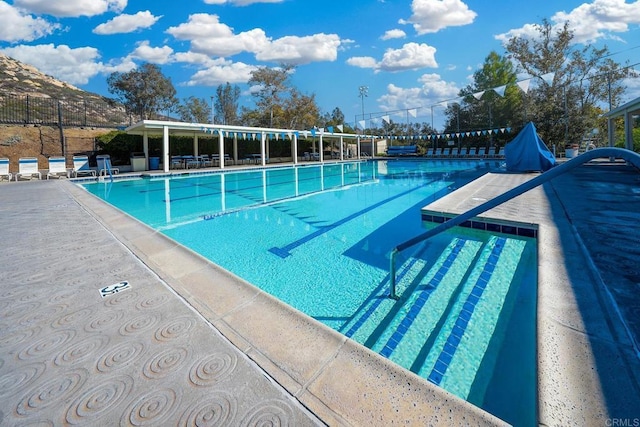 view of swimming pool featuring a mountain view