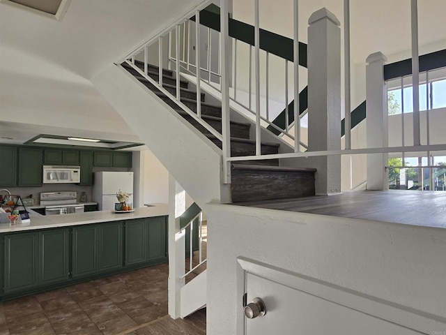 stairway with a towering ceiling