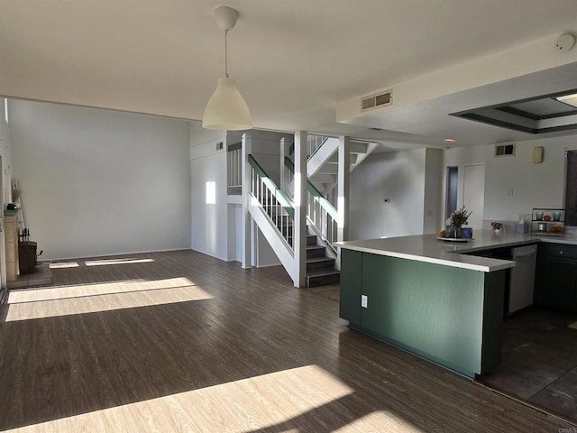 kitchen featuring stainless steel dishwasher, dark hardwood / wood-style flooring, and green cabinetry