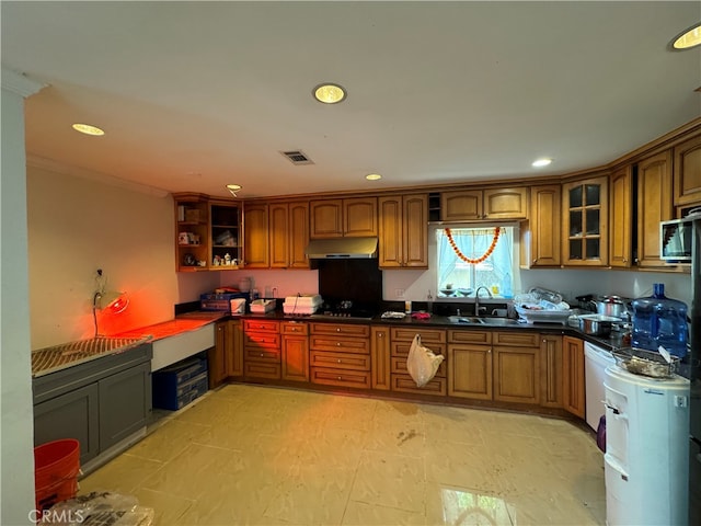 kitchen featuring black gas cooktop, sink, built in desk, and light tile floors