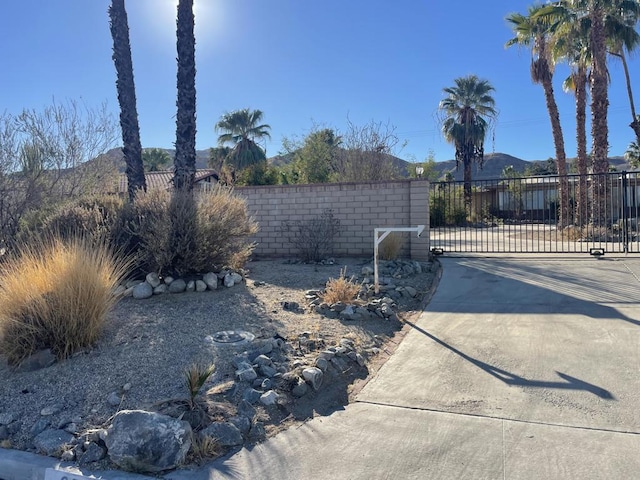 view of gate with a mountain view