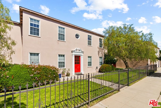 view of front of property with a front lawn