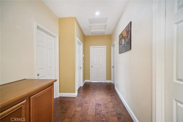 corridor with dark hardwood / wood-style floors