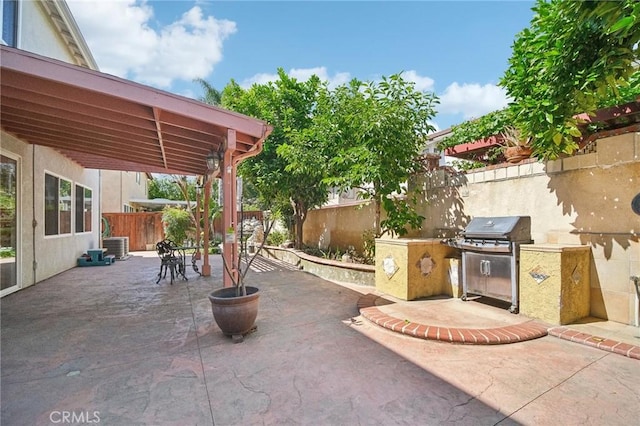 view of patio with a grill