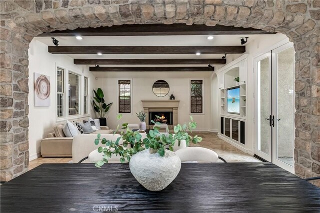 living room with beam ceiling