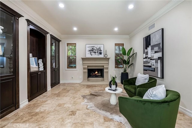 living room with visible vents, baseboards, a lit fireplace, ornamental molding, and recessed lighting