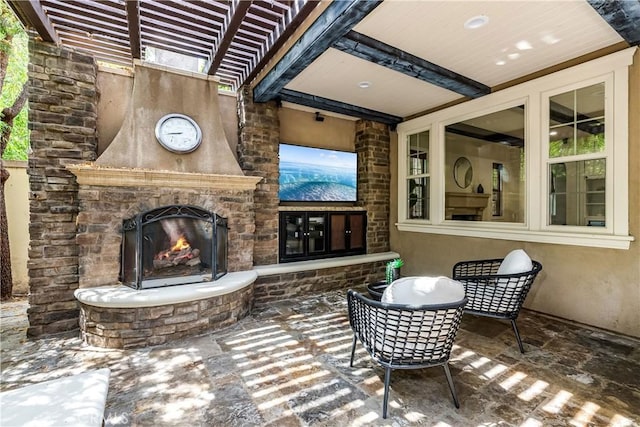 view of patio / terrace with an outdoor stone fireplace