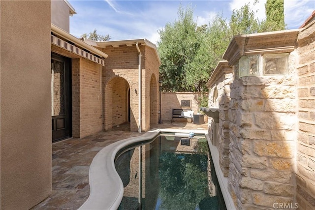 view of pool featuring a patio area