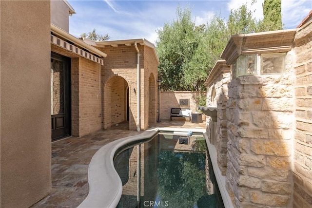 view of swimming pool with a patio