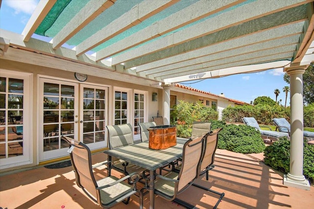 view of terrace featuring a pergola and french doors