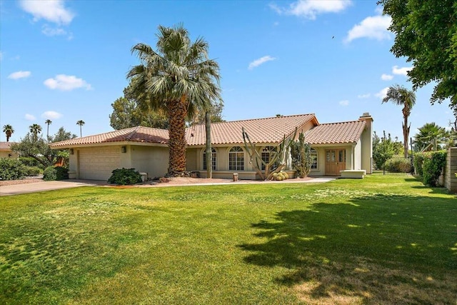 view of front facade featuring a front lawn and a garage