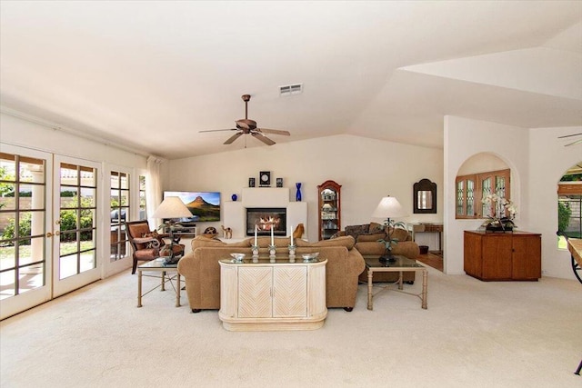 carpeted living room featuring lofted ceiling and ceiling fan