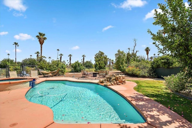 view of swimming pool with a patio