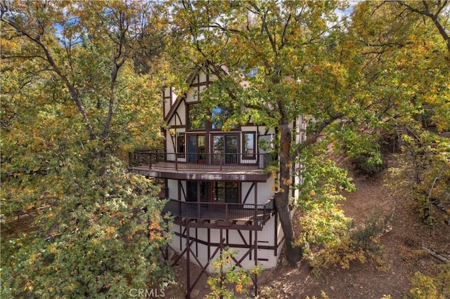 rear view of property featuring a chimney