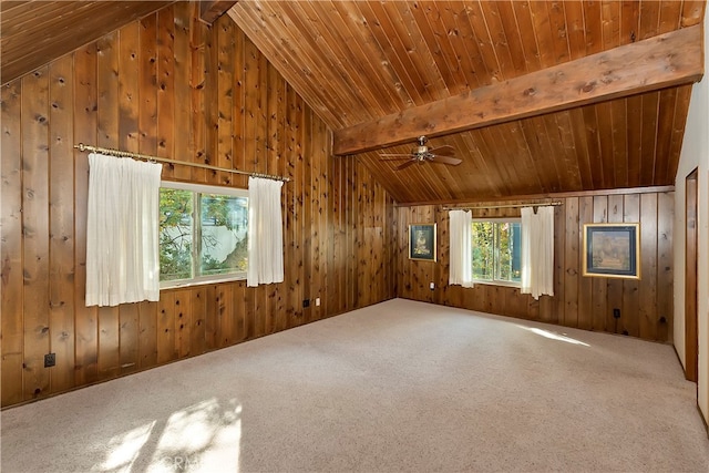 interior space with carpet, ceiling fan, wooden ceiling, wood walls, and lofted ceiling with beams