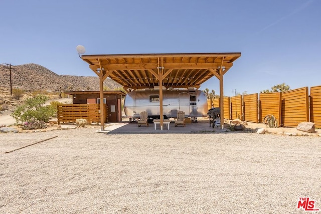 view of patio / terrace featuring a mountain view