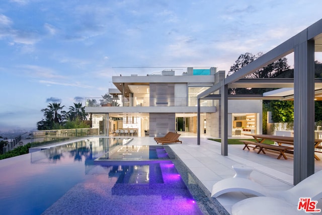 view of swimming pool featuring a patio area