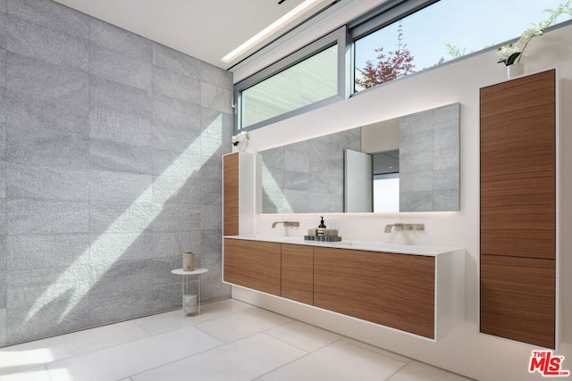 bathroom with tile floors and vanity