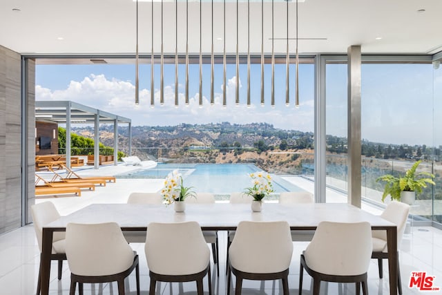 dining area with a wall of windows