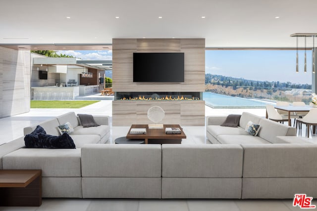 living room with light tile floors and expansive windows