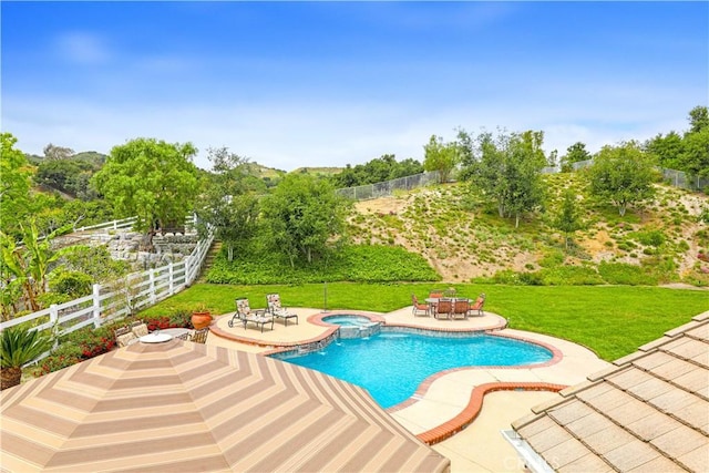 view of swimming pool with a patio area, an in ground hot tub, and a yard