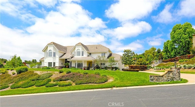 view of front of property with a front lawn