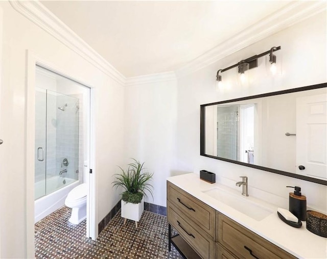 full bathroom with tile patterned flooring, enclosed tub / shower combo, toilet, vanity, and ornamental molding