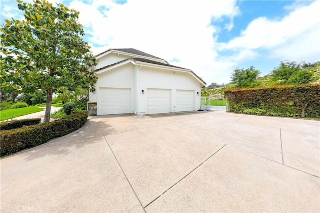 view of side of home with a garage