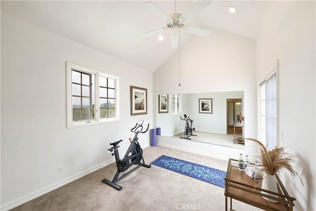 exercise room featuring ceiling fan, carpet floors, and high vaulted ceiling