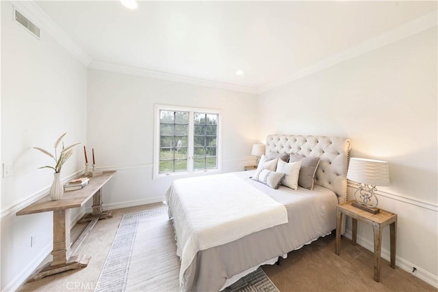 carpeted bedroom featuring ornamental molding