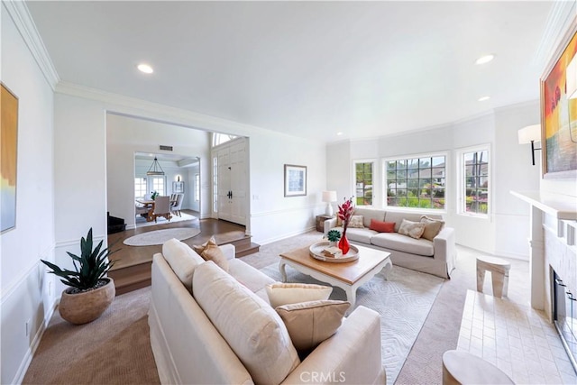 carpeted living room featuring a fireplace and crown molding