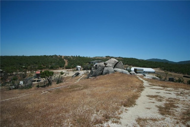 exterior space with a mountain view and a rural view