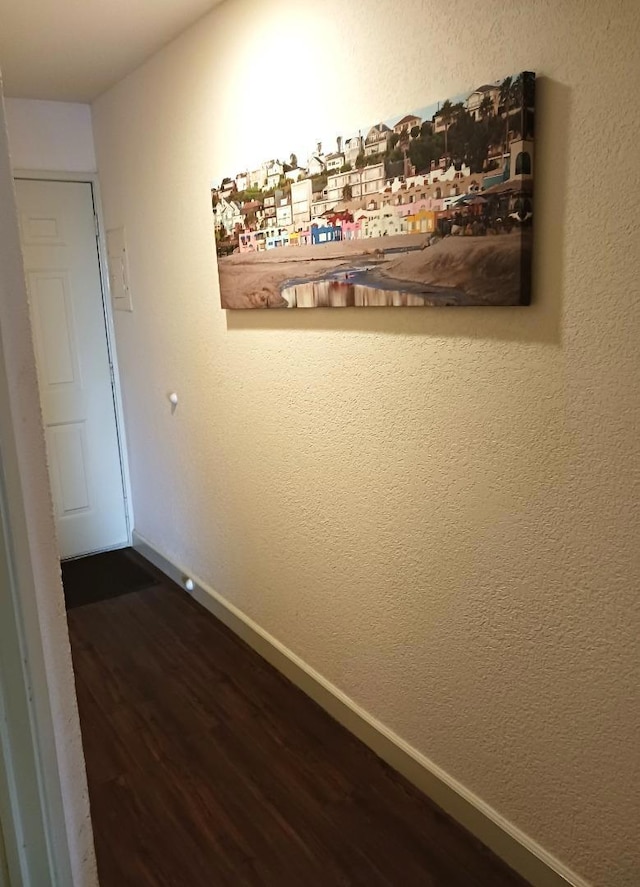 hall with hardwood / wood-style flooring