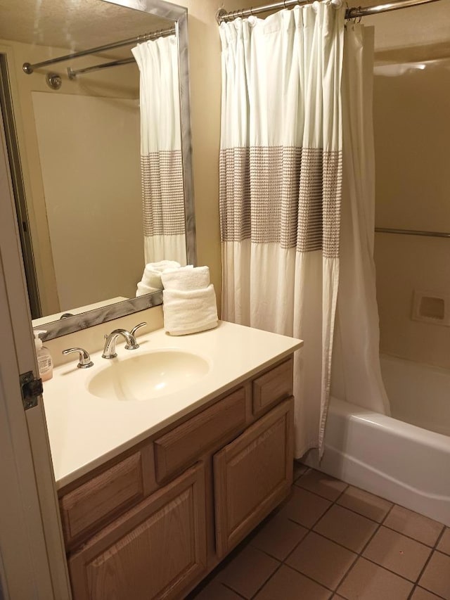 bathroom featuring tile patterned floors, shower / tub combo with curtain, and vanity