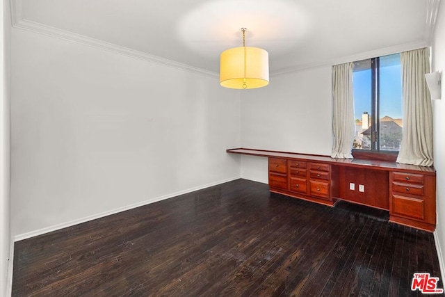 spare room with dark hardwood / wood-style flooring and crown molding