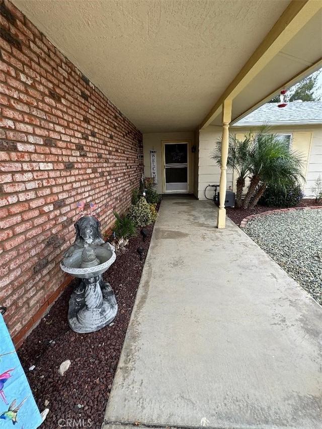 property entrance with a patio