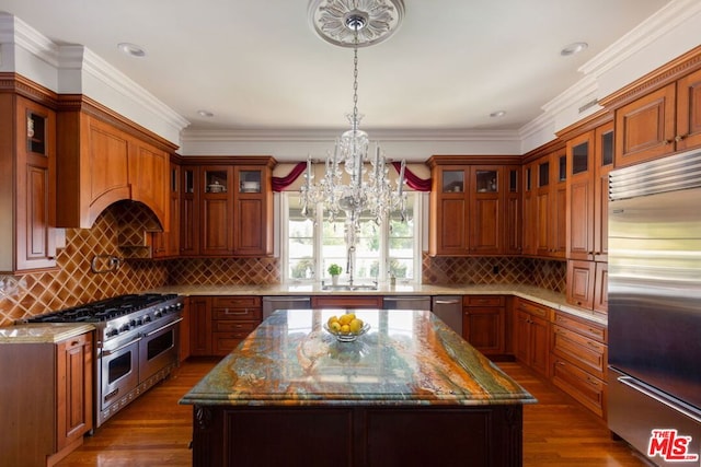 kitchen with a center island, backsplash, and premium appliances