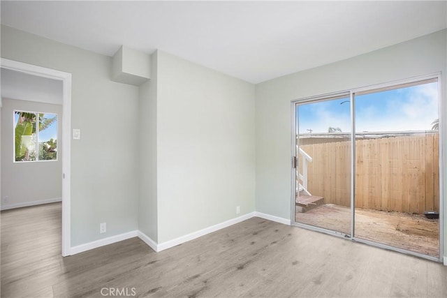 unfurnished room featuring hardwood / wood-style floors