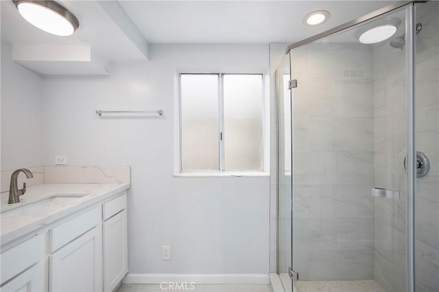 bathroom with vanity and walk in shower