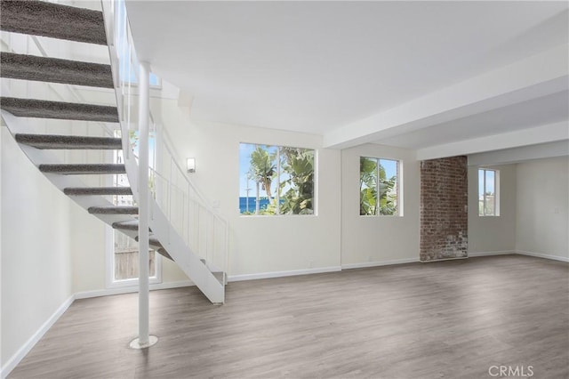 unfurnished living room featuring wood-type flooring