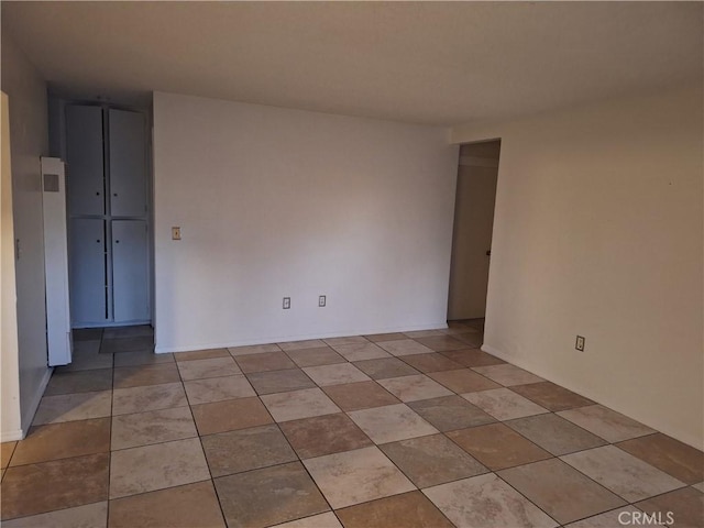 empty room featuring light tile patterned flooring