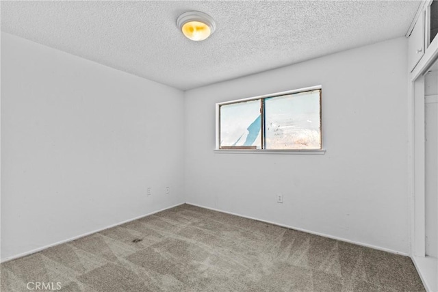 315 S Mistletoe Ave, San Jacinto, CA 92583 - spare room featuring carpet and a textured ceiling