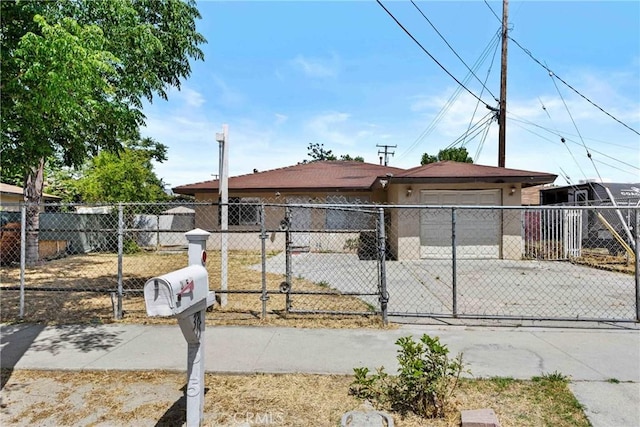 315 S Mistletoe Ave, San Jacinto, CA 92583 - ranch-style house with an attached garage, driveway, a fenced front yard, and stucco siding
