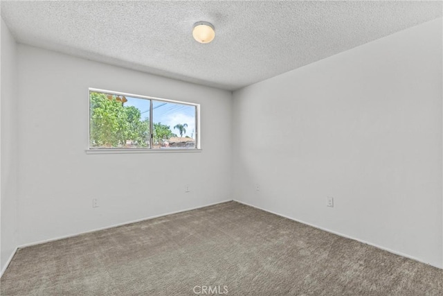 315 S Mistletoe Ave, San Jacinto, CA 92583 - spare room featuring carpet and a textured ceiling