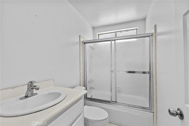 315 S Mistletoe Ave, San Jacinto, CA 92583 - bathroom with toilet, bath / shower combo with glass door, and vanity