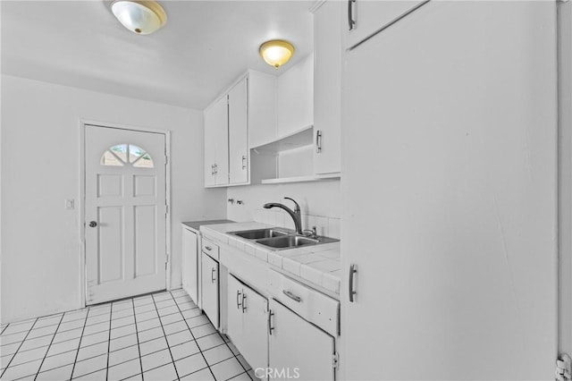 315 S Mistletoe Ave, San Jacinto, CA 92583 - kitchen featuring a sink, white cabinets, tile countertops, and light tile patterned flooring