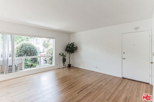 unfurnished room featuring light wood-type flooring