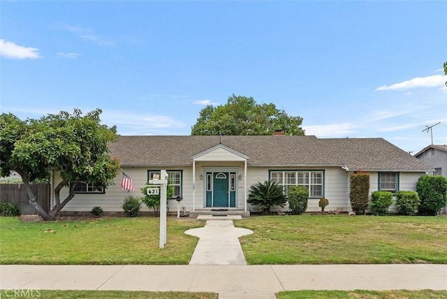 ranch-style house featuring a front lawn